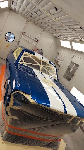 Blue and white specialty paint work in Beck paint booth