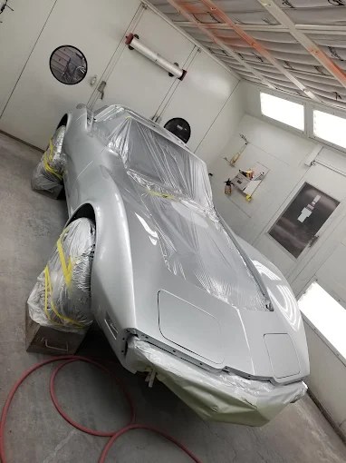 Corvette masked and prepared in paint booth