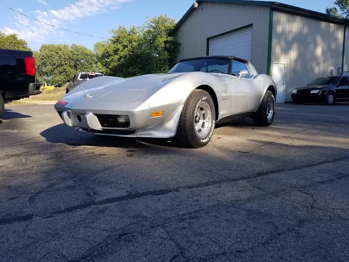 Silver Corvette outside Beck Auto and Truck Body
