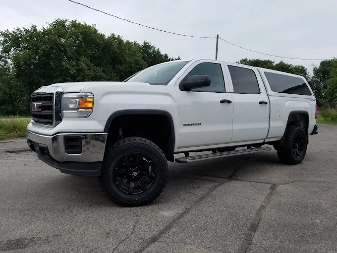 Lifted white GMC Sierra