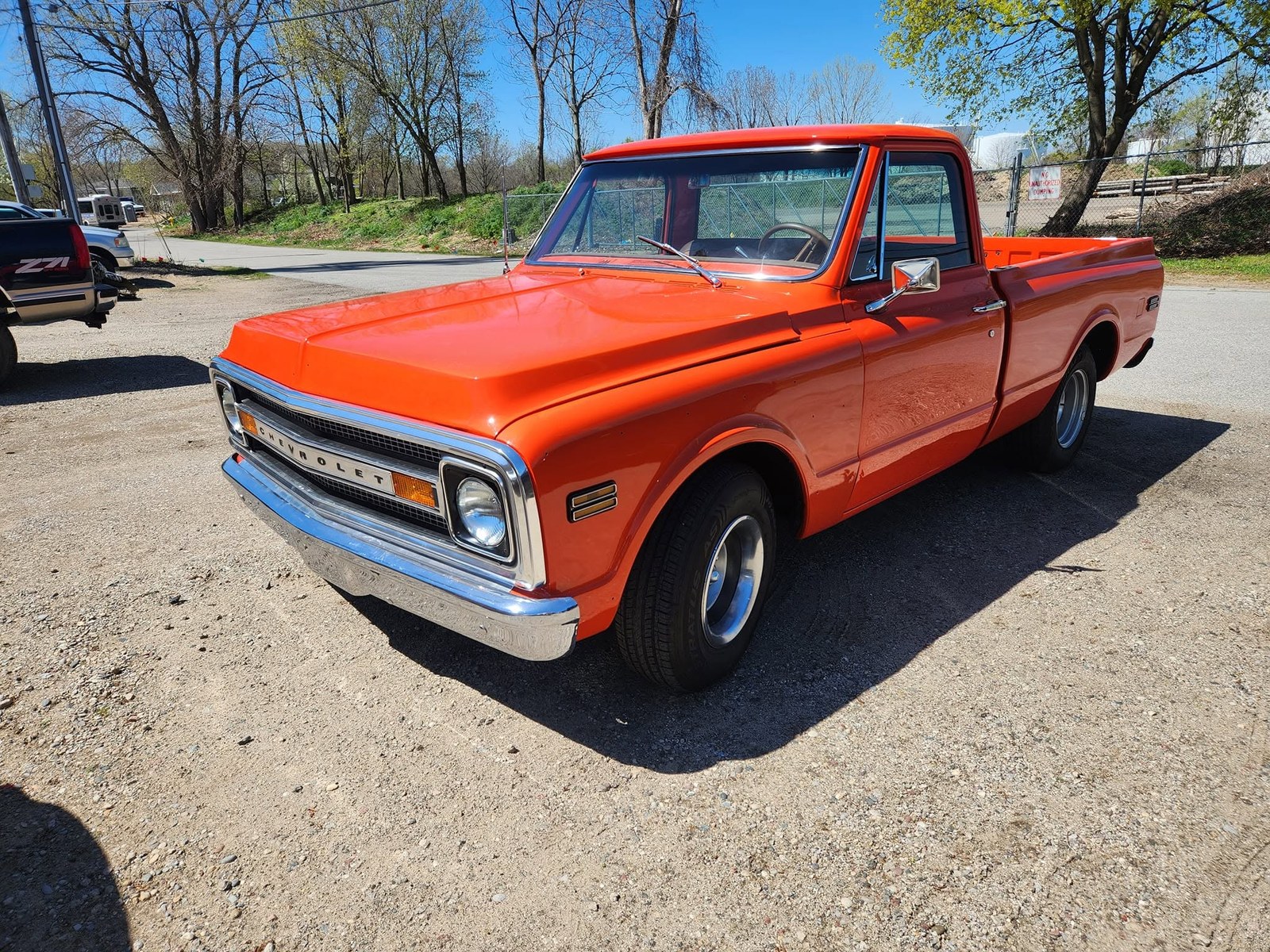 Orange classic truck at Kimber Auto Body and Paint