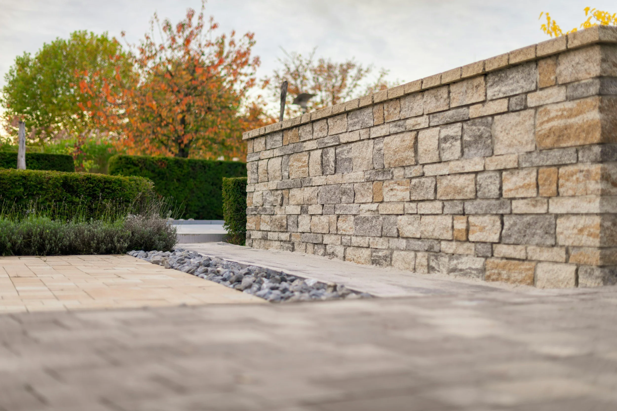 Stone hardscape wall and landscaped property